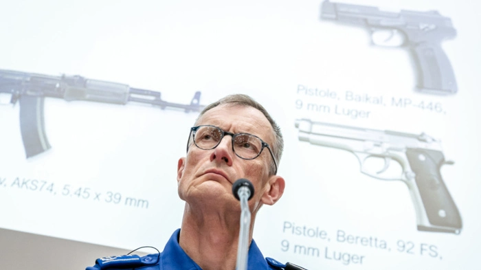 Aargau Canton Police Commander, Michael Leupold attends a news conference and shows illustrative image of weapons of the same design as those used in the crime following a deadly shooting at a rave party on the Schachen horse racing track in Aarau, on Wednesday, September 2, 2026 in Schafisheim near Aarau, Switzerland. (KEYSTONE/Michael Buholzer)