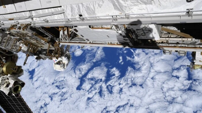 This handout photo from the European Space Agency (ESA) taken on August 25, 2026, shows ESA French astronaut Sophie Adenot at work during a spacewalk outside the International Space Station (ISS). During the 6-hour, 30-minute spacewalk, Sophie and NASA astronaut Anil Menon completed the installation and activation of a spare Space-to-Ground Antenna (SGANT), finishing work that had begun on 18 August, when stuck bolts and connectors on the failed antenna delayed their progress. (Photo by Handout / EUROPEAN SPACE AGENCY / AFP) / RESTRICTED TO EDITORIAL USE - MANDATORY CREDIT "AFP PHOTO / EUROPEAN SPACE AGENCY / HANDOUT" - HANDOUT - NO MARKETING NO ADVERTISING CAMPAIGNS - DISTRIBUTED AS A SERVICE TO CLIENTS
