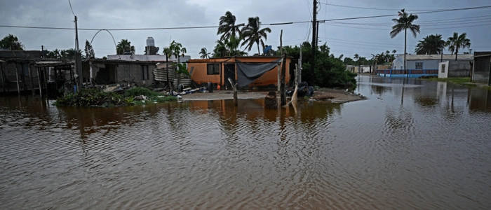A flooded street is pictured following the arrival of Hurricane Polo in the town of Puerto San Carlos, Baja California Sur, Mexico, on September 29, 2026. Hurricane Polo made landfall on Mexico's Baja California peninsula on September 29, cutting power and causing flooding as the sea breached coastal defenses. The Category 3 storm is the latest in a busy storm season turbo-charged by the El Nino weather phenomenon, which has caused unprecedented warming in the equatorial Pacific. (Photo by Carl de Souza / AFP)