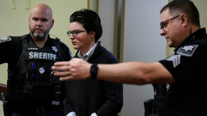 Colt Gray, the teenager accused of the fatal mass shooting at Georgia's Apalachee High School, attends a hearing at the Barrow County Courthouse in Winder, Georgia, on December 9, 2025. On September 4, 2024, Colt Gray, then 14, allegedly shot eleven people, killing two students and two teachers, at Apalachee High School near Winder, Georgia, United States. He faces numerous felony murder and other charges while his father Colin Gray faces charges related to providing the weapon. (Photo by Mike Stewart / POOL / AFP) / POOL PHOTO