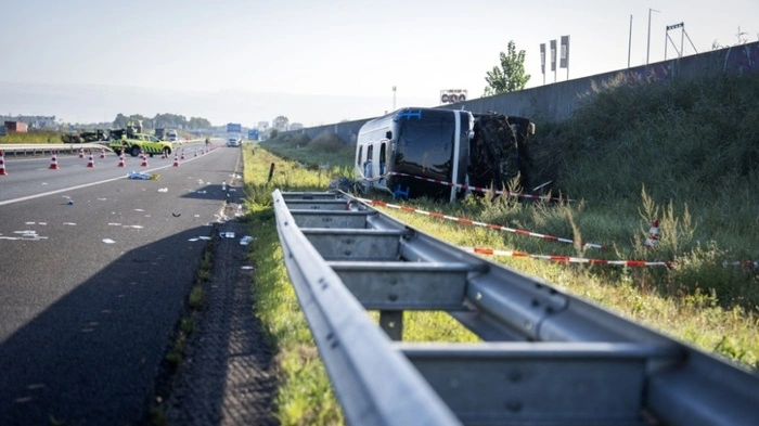 Emergency services work at the site of a raod accident between a delivery van and an Austrian tour bus, where multiple people were injured, on the A28 motorway near Wezep, eastern Netherlands, on August 24, 2026. (Photo by Jeroen Jumelet / ANP / AFP) / Netherlands OUT