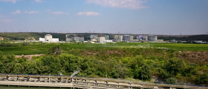 A general view of Cernavoda Nuclear Power Plant (CNE Cernavoda) in Cernavoda city, next to Danube-Black Sea channel September 3, 2025. The Nuclear Power Plant in Cernavod? is the only nuclear power plant in Romania. It produces around 20% of the country's electricity. The nuclear plant uses CANDU (Canada deuterium uranium) reactor technology from AECL (Atomic Energy of Canada Limited). The initial plan was to build four units, and schedule their startup from 1985 onward. A fifth unit was subsequently planned on the direct orders of Communist leader Nicolae Ceausescu. Units 1 and 2 are currently operational. Three more partially completed CANDU reactors exist on the same site, numbered Unit 3 to Unit 5. (Photo by Daniel MIHAILESCU / AFP)