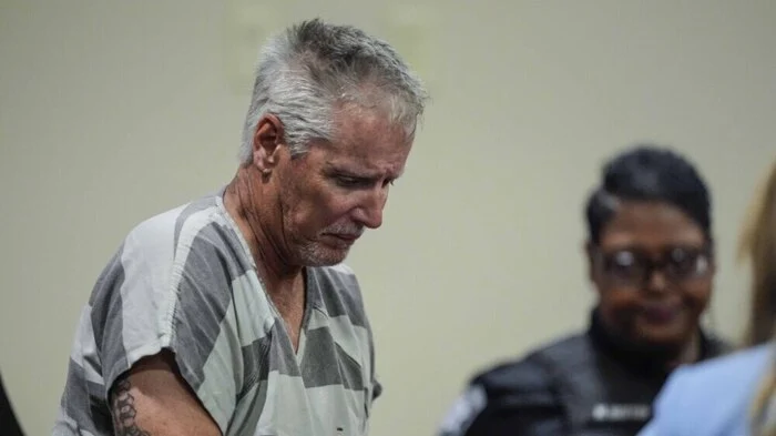 WINDER, GEORGIA - SEPTEMBER 6: Colin Gray, 54, the father of Apalachee High School shooting suspect Colt Gray, 14, enters the Barrow County courthouse for his first appearance, on September 6, 2024, in Winder, Georgia. Colin Gray is being charged with involuntary manslaughter, second-degree murder and cruelty to children after his son opened fire and killed 4 at the high school on Wednesday. Brynn Anderson-Pool/Getty Images/AFP (Photo by POOL / GETTY IMAGES NORTH AMERICA / Getty Images via AFP)