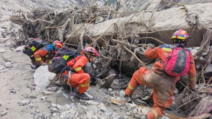 Fire and rescue personnel conduct search and rescue operations at the site of Gyirong Port days after the August 26 mudslide which destroyed the port, in Gyirong County, in China’s western Tibet region on August 29, 2026. (Photo by CNS / AFP) / China OUT