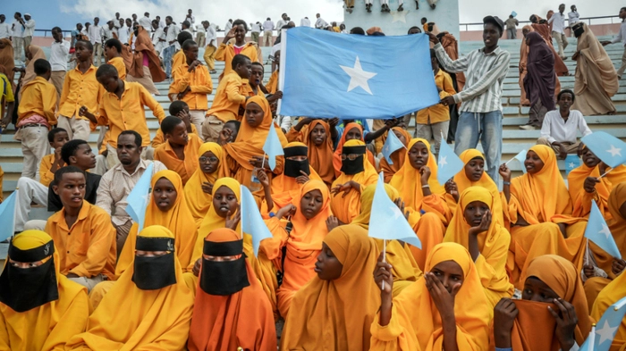 Residents wave Somali flags as they attend a rally denouncing Israel’s recent announcement recognizing the breakaway Somaliland region, during a gathering calling for Somalia’s territorial unity at Mogadishu Stadium in Mogadishu on December 30, 2025. Israel's recognition of the breakaway region of Somaliland is a "threat" to security and stability in the Horn of Africa and encourages secessionist groups, Somali President Hassan Sheikh Mohamud said on December 28, 2025..Israel announced on December 26, 2025 that it was officially recognising Somaliland, a first for the self-proclaimed republic that in 1991 declared it had unilaterally separated from Somalia. (Photo by Hassan Ali ELMI / AFP)