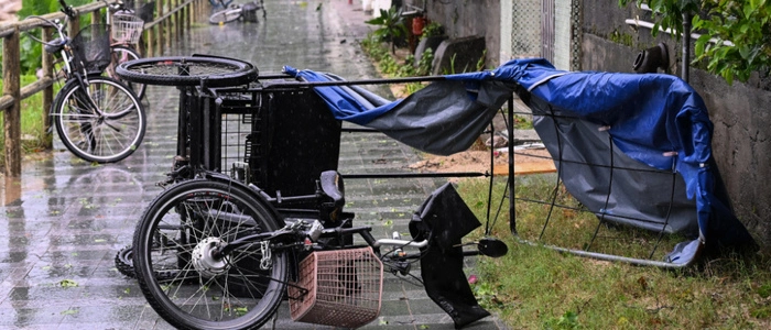 A trike is seen overturned on a beach path by strong winds from Typhoon Noul which passed close to Hong Kong on July 26, 2026. (Photo by Peter PARKS / AFP)