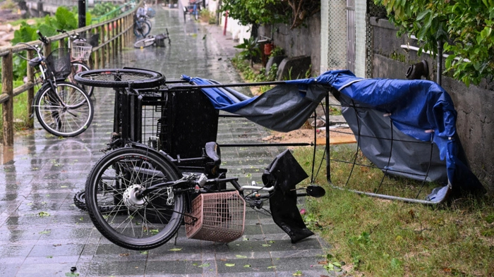 A trike is seen overturned on a beach path by strong winds from Typhoon Noul which passed close to Hong Kong on July 26, 2026. (Photo by Peter PARKS / AFP)