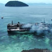 This screen grab aerial picture from a handout video taken and received from the Philippine Coast Guard (PCG) on September 10, 2026 shows the ruins of a ferry that caught fire off Palawan. At least five people were killed and 86 remain missing after a fire erupted aboard a ferry near a tourist hotspot in the Philippine province of Palawan, the coast guard said on September 10. (Photo by Handout / Philippine Coast Guard (PCG) / AFP) / RESTRICTED TO EDITORIAL USE - MANDATORY CREDIT "AFP PHOTO / Philippine Coast Guard (PCG)" - HANDOUT - NO MARKETING NO ADVERTISING CAMPAIGNS - DISTRIBUTED AS A SERVICE TO CLIENTS