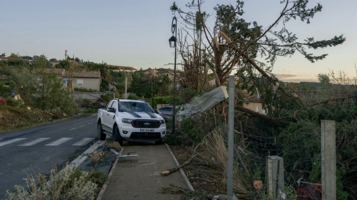 This photograph taken on August 24, 2026, shows damaged vehicles and houses after a tornado struck Pomas, southwestern France. A tornado struck the Aude department on August 24 as part of southwestern France remained under an orange storm alert, with several rooftops torn off in the village of Pomas, an AFP photographer at the scene reported. (Photo by Idriss Bigou-Gilles / AFP)