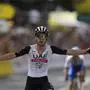 Britain's Adam Yates celebrates after crossing the finish line of the first stage of the Tour de France cycling race over 182 kilometers (113 miles) with start and finish in Bilbao, Spain, Saturday, July 1, 2023. (AP Photo/Thibault Camus)