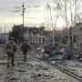 In this photo taken from video distributed by the Russian Defense Ministry Press Service on Thursday, March 13, 2025, Russian soldiers patrol an area in Sudzha, in the Kursk region of Russia, after it was taken over by Russian troops. (Russian Defense Ministry Press Service via AP)
 