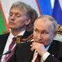 Putin und sein Sprecher Peskow