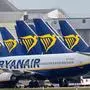 (FILES) In this file photo taken on March 23, 2020 Ryanair passenger jets are seen on the tarmac at Dublin airport. - Irish low-cost carrier Ryanair said on May 1, 2020 that it plans to axe up to 3,000 pilot and cabin crew jobs, with air transport paralysed by the coronavirus pandemic. (Photo by Paul Faith / AFP)