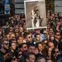 People hold up a placard reading "The King is naked" during an anti-government rally in the centre of Budapest on March 15, 2024, on National Day that marks the Hungarian revolution against the Austrian Empire in 1848. The demonstration was organised by Peter Magyar, who has held several senior positions in Hungarian state companies and is a critic of Hungarian Premier Orban's system of power. Orban has been facing rare public anger, following the shock resignations of two of his allies over a child sex abuse case. Hungary's President Katalin Novak and former Justice Minister Judit Varga (Magyar's former wife) -- the ruling Fidesz party's most prominent women -- had to step down in mid-February 2024 over the pardoning of a convicted child abuser's accomplice. (Photo by FERENC ISZA / AFP)