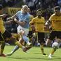 Manchester City's Erling Haaland tries to score during the English Premier League soccer match between Wolverhampton Wanderers and Manchester City at Molineux stadium in Wolverhampton, England, Saturday, Sept. 17, 2022. (AP Photo/Rui Vieira)