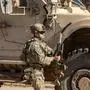 A US soldier patrols an area in the town of Tal Hamis, southeast of the city of Qameshli in Syria's northeastern Hasakeh governorate, on January 24, 2024. (Photo by Delil SOULEIMAN / AFP)