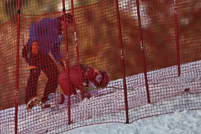Austria’s Vincent Kriechmayr receives assistance after he crashed while competing in the men's Downhill event at the FIS Alpine Skiing World Cup in Wengen on January 18, 2025. (Photo by FABRICE COFFRINI / AFP)