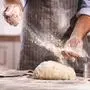 hands of the baker's male knead dough
