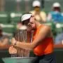 Russia's Mirra Andreeva poses with the trophy after defeating Belarus' Aryna Sabalenka during the women’s singles final tennis match at the BNP Paribas Open at the Indian Wells Tennis Garden in Indian Wells, California, on March 16, 2025. (Photo by Patrick T. Fallon / AFP)