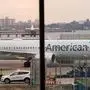 (FILES) In this file photo taken on March 13, 2019 an American Airlines 737 Max sits at the gate at LaGuardia airport in New York. - US pilots on January 30, 2020, sued American Airlines to force the company to halt flights to China amid the virus outbreak now declared a global health emergency. The new coronavirus has sickened nearly 8,000 and killed 170 people in China, and cases of the respiratory illness have been reported in several other countries including the United States. (Photo by Don EMMERT / AFP)