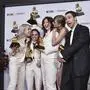 Phoebe Bridgers, from left, Julien Baker, and Lucy Dacus of boygenius pose in the press room with the awards for best rock performance and best rock song for "Not Strong Enough," and best alternative music album for "The Record." Taylor Swift, center right, and Jack Antonoff pose with the award for record of the year for "Midnights" during the 66th annual Grammy Awards on Sunday, Feb. 4, 2024, in Los Angeles. (Photo by Richard Shotwell/Invision/AP)