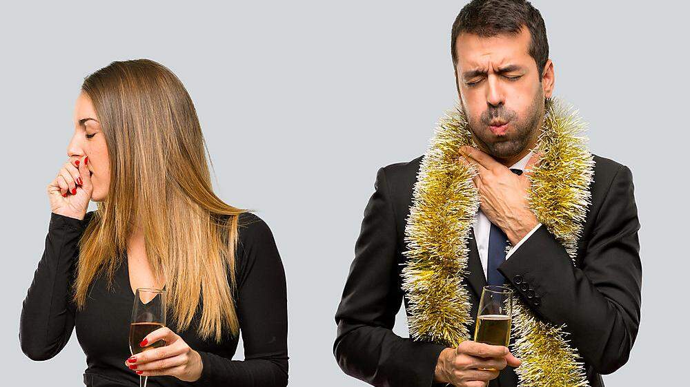 Man with champagne celebrating new year 2019 is suffering with cough and feeling bad
