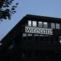 FILE - In this July 20, 2021 file photo, the logo of payment company Wirecard is pictured at the headquarters in Munich, Germany. German lawmakers say they plan to question Chancellor Angela Merkel and her deputy about their involvement with the collapsed payment systems provider Wirecard next month. (AP Photo/Matthias Schrader, File)