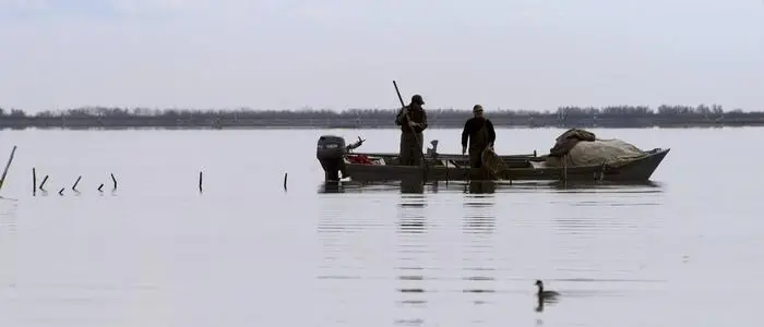 Fischer in der Lagune von Grado