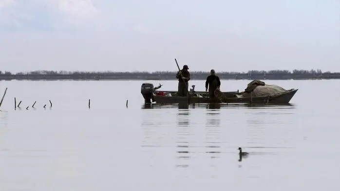 Fischer in der Lagune von Grado