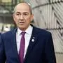 Slovenia's Prime Minister Janez Jansa speaks with the media as he arrives for an EU summit in Brussels, Friday, Oct. 16, 2020. European Union leaders meet for the second day of an EU summit, amid the worsening coronavirus pandemic, to discuss topics on foreign policy issues. (Johanna Geron, Pool via AP)