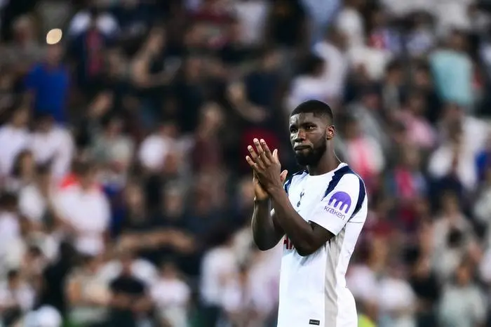 Tottenham Hotspur's Austrian defender #04 Kevin Danso reacts at the end of the 2025 UEFA Super Cup final football match between Paris Saint-Germain (FRA) and Tottenham Hotspur FC (ENG) at the Friuli stadium, in Udine, on August 13, 2025. (Photo by Marco BERTORELLO / AFP)
