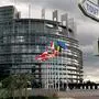 FILE - In this Oct. 10, 2000 file photo, European Union member flags fly outside the European Parliament building in Strasbourg, France. The EU assembly leads a pricey and nomadic life. Once a month, it shifts thousands of lawmakers, their staffs, translators and interpreters to Strasbourg, France, 400 kilometers (250 miles) away, for a four-day meeting. And then it trucks them all back to Brussels again. (AP Photo/Andreas Pechar, File)