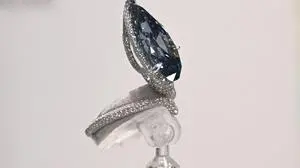 The Mellon Blue, a fancy Vivid Blue pear-shaped cut diamond of 9.51 carats which once belonged to Bunny Mellon, the American Garden Queen, is seen at a Christie's auction preview in Hong Kong on October 23, 2025. It will be auctioned on November 11, 2025 in Geneva, Switzerland for an estimated USD 20,000,000 - 30,000,000. (Photo by Peter PARKS / AFP)