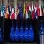 (FILES) In this file photo taken on November 29, 2019 European Union flags are displayed at the European Council headquarters in Brussels. - A major meeting of European leaders, it is a milestone in the history of the Union: the European Summit, a place for negotiations at the highest level and the scene of major breakthroughs, has been organised for a week by videoconference, a format used in times of health crises that limits interaction and complex negotiations. (Photo by Kenzo TRIBOUILLARD / AFP)