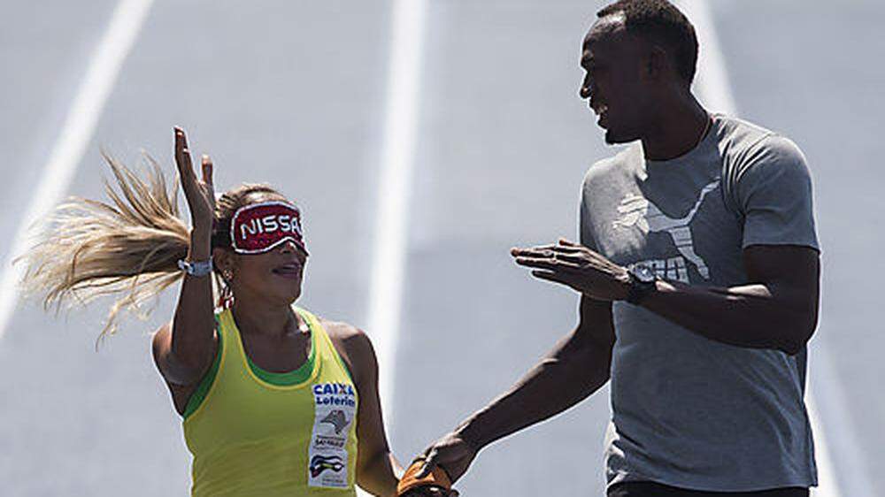 Usain Bolt Hand in Hand mit der blinden Athletin Terezinha Guilhermina 