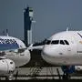 (FILES) Parked aircrafts operated by German airline Lufthansa are pictured at Berlin Brandenburg BER airport Willy-Brandt in Schoenefeld near Berlin on May 31, 2021. German airline Lufthansa on April 11, 2024 said it would continue to suspend flights to and from Tehran until April 13 due to tensions in the Middle East. "Due to the current situation, Lufthansa is suspending its flights to and from Tehran up to and including Saturday, 13 April, after careful evaluation," the airline said in a statement. (Photo by Tobias Schwarz / AFP)