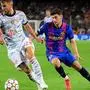 Bayern Munich's French defender Lucas Hernandez vies for the ball with Barcelona's Austrian forward Yusuf Demir (R) during the UEFA Champions League first round group E football match between Barcelona and Bayern Munich at the Camp Nou stadium in Barcelona on September 14, 2021. (Photo by LLUIS GENE / AFP)