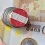 euro coin with national flag of austria on the euro money banknotes background. finance concept