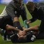Sturm's Gregory Wuethrich is treated by medics during the Champions League opening phase soccer match between Brest and Sturm Graz in Guingamp, western France, Thursday, Sept. 19, 2024. (AP Photo/Christophe Ena)