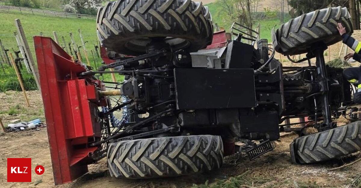 Tractor with driver in cab rolled down steep terrain