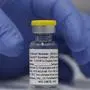 FILE - In this Wednesday, Oct. 7, 2020, file photo, a vial of the Phase 3 Novavax coronavirus vaccine is seen ready for use in the trial at St. George's University hospital in London. The Novavax COVID-19 vaccine has become the fifth coronavirus vaccine approved for use in Australia, Thursday, Jan. 20, 2022. The country has ordered 51 million doses of the U.S.-manufactured vaccine, supplied under the brand Nuvaxovid, for its population of 26 million. (AP Photo/Alastair Grant, File)