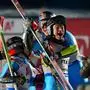 (From L) Italy's Giorgia Collomb, Italy's Alex Vinatzer and Italy's Filippo Della Vite celebrate in the finish area after winning the mixed team parallel final race of the Saalbach 2025 FIS Alpine World Ski Championships in Hinterglemm on February 4, 2025. (Photo by Dimitar DILKOFF / AFP)