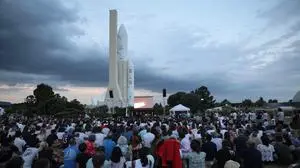 Attendees take part in a public screening projection of the takeoff of the Ariane 6 rocket at the Cite de l'Espace, in Toulouse, south-western France, on July 9, 2024. The Ariane 6 rocket took off on July 9 from its Kourou launch pad, in Guyana, for its inaugural launch intended to qualify in flight the new launcher which should ensure Europe's autonomous access to space, noted a journalist of the AFP. (Photo by Valentine CHAPUIS / AFP)