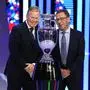 The head coaches of the Netherlands Ronald Koeman, left, and Austria Ralf Rangnick, right, pose next to the trophy after the draw for the UEFA Euro 2024 soccer tournament finals in Hamburg, Germany, Saturday, Dec. 2, 2023. (AP Photo/Martin Meissner)