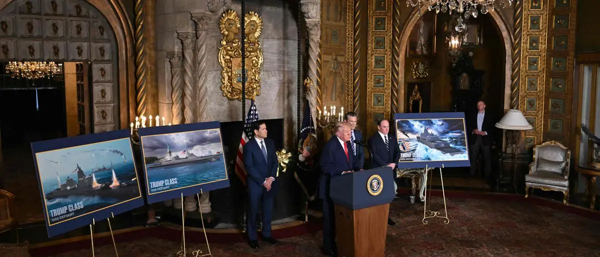 US President Donald Trump (2L) flanked by US Secretary of State Marco Rubio (L), US Secretary of Defense Pete Hegseth (2R) and US Navy Secretary John Phelan (R), announces the US Navy’s new Golden Fleet initiative, unveiling a new class of frigates, at Mar-a-Lago in Palm Beach, Florida, on December 22, 2025. (Photo by ANDREW CABALLERO-REYNOLDS / AFP)