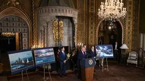 US President Donald Trump (2L) flanked by US Secretary of State Marco Rubio (L), US Secretary of Defense Pete Hegseth (2R) and US Navy Secretary John Phelan (R), announces the US Navy’s new Golden Fleet initiative, unveiling a new class of frigates, at Mar-a-Lago in Palm Beach, Florida, on December 22, 2025. (Photo by ANDREW CABALLERO-REYNOLDS / AFP)