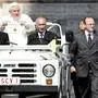 ** FILE ** Chief of the Vatican's security services Domenico Giani, 44, right, looks out as Pope Benedict XVI makes his entrance on the SCV 1 papal jeep in St. Peter's Square at the Vatican, during the weekly general audience in this June 7, 2006 file photo. Giani is chief of papal security, head of a contingent of Vatican officers easily distinguished in their dark suits who protect one of the world's most visible figures at a time of increased security concerns. Benedict's speech in Germany in September that linked Islam to violence sowed anger across the Islamic world, raising concerns for his safety during his visit to Turkey next week, his first trip to a Muslim country.  (AP Photo/Plinio Lepri)
