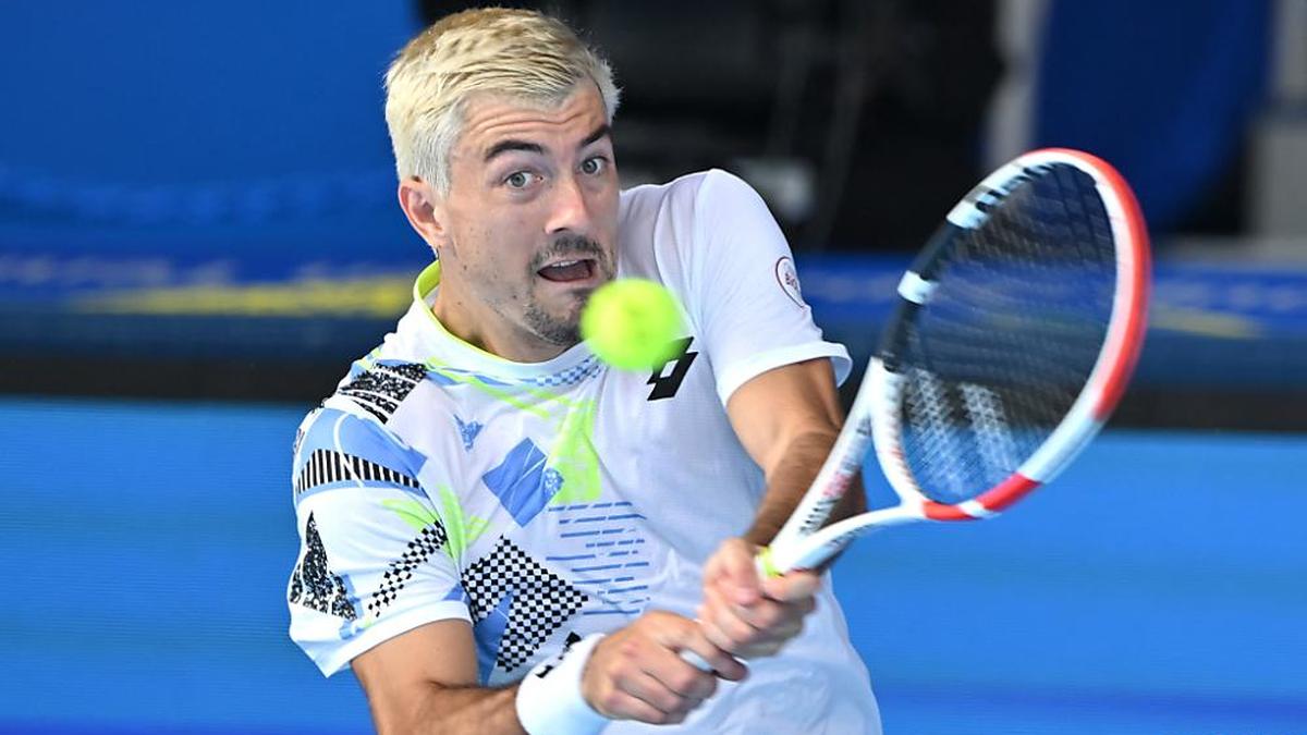 Austria's Sebastian Ofner hits a return against Canada's Felix Auger-Aliassime during their mens singles match on day three of the ATP Japan Open tennis tournament in Tokyo on October 18, 2023. (Photo by Kazuhiro NOGI / AFP)