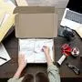 Top above closeup view of female online store small business owner entrepreneur packing package post shipping box preparing delivery parcel on table. Ecommerce dropshipping shipment service concept.