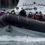 A group of people thought to be migrants are brought in to Dover, Kent, onboard a Border Force vessel following a small boat incident in the Channel, Wednesday, April 13, 2022. Britain's Conservative government has struck a deal with Rwanda to send some asylum-seekers thousands of miles away to the East African country, a move that opposition politicians and refugee groups condemned as inhumane, unworkable and a waste of public money. (Gareth Fuller/PA via AP)
